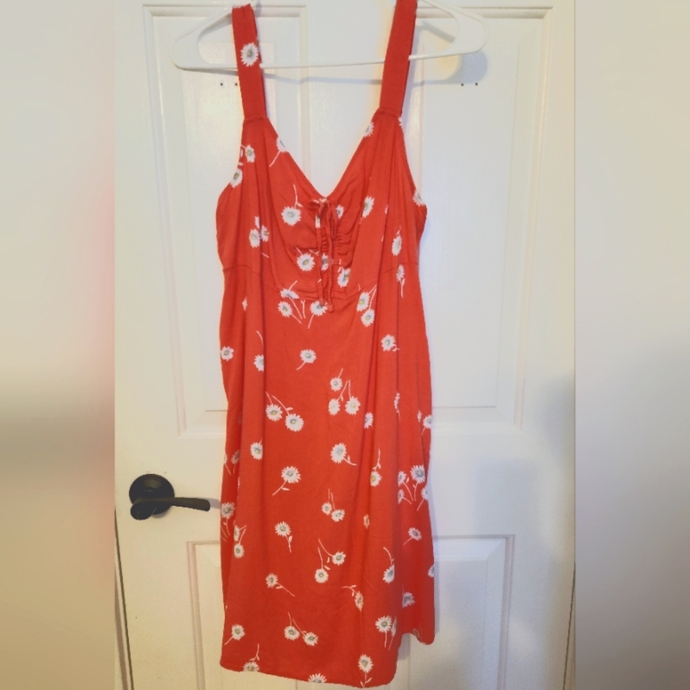 Peach/orange dress with white flowers. Material is is very cool and soft.